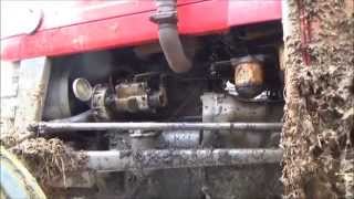 changing the oil filter on a Massey Ferguson 135 tractor [upl. by Besnard577]