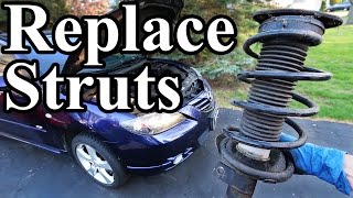 How to Replace Struts in your Car or Truck [upl. by Ruenhs]